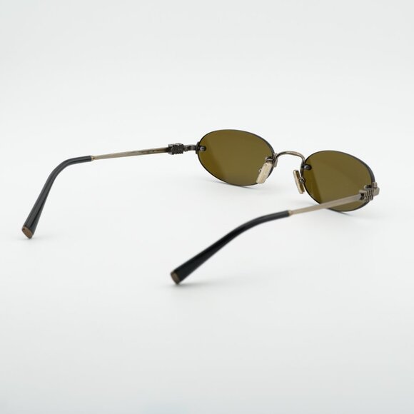 Miu Miu MUA54S 26C09Z Sunglasses Old Gold Oval Frame, Dark Brown Lenses